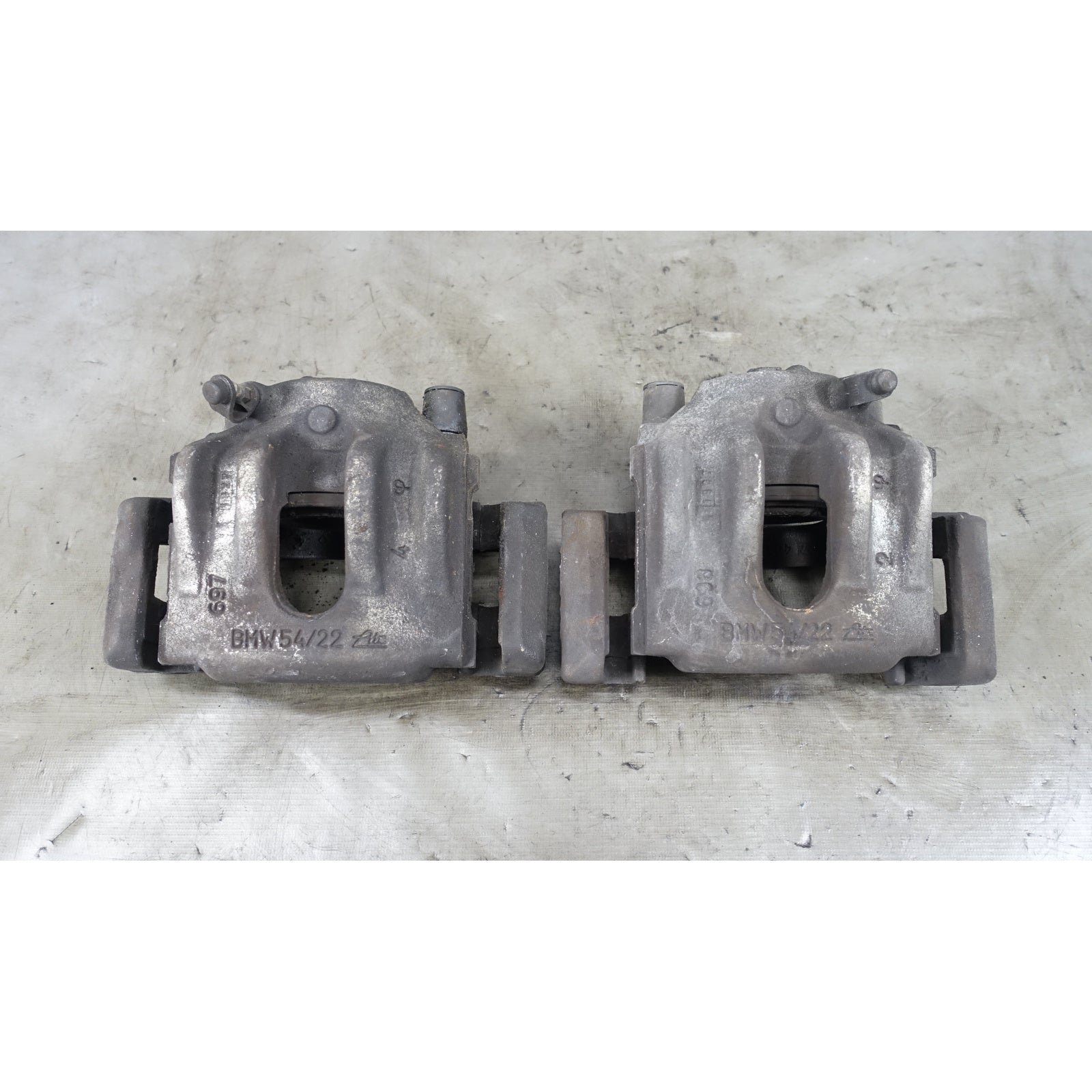 inv_056094.jpg 1992-2006 BMW E36 E46 Z3 Factory Front Brake Caliper Carrier Pair OEM - Image 1